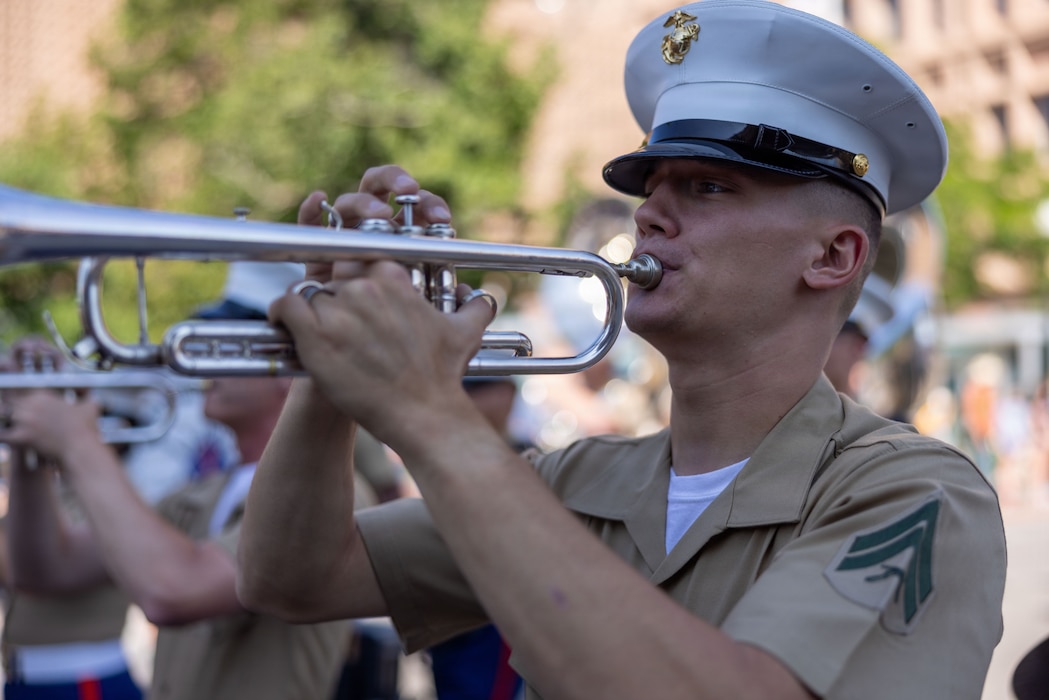 U.S. Marine Corps Cpl. Brandon Davis, a trumpet instrumentalist with the 1st Marine Division Band, plays the trumpet during the Cheyenne Frontier Days Festival Parade in Cheyenne, Wyoming, July 18, 2026. The 130th annual Cheyenne Frontier Days is a 10-day festival drawing nearly 200,000 visitors and features the world’s largest outdoor rodeo and western entertainment in Cheyenne, Wyoming. (U.S. Marine Corps photo by Lance Cpl. Aiyana Bridges)