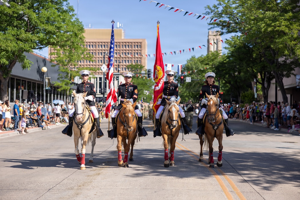 U.S. Marine Corps Mounted Color Guard present the colors during the Cheyenne Frontier Days Festival Parade in Cheyenne, Wyoming, July 18, 2026. The 130th annual Cheyenne Frontier Days is a 10-day festival drawing nearly 200,000 visitors and features the world’s largest outdoor rodeo and western entertainment in Cheyenne, Wyoming. (U.S. Marine Corps photo by Lance Cpl. Aiyana Bridges)