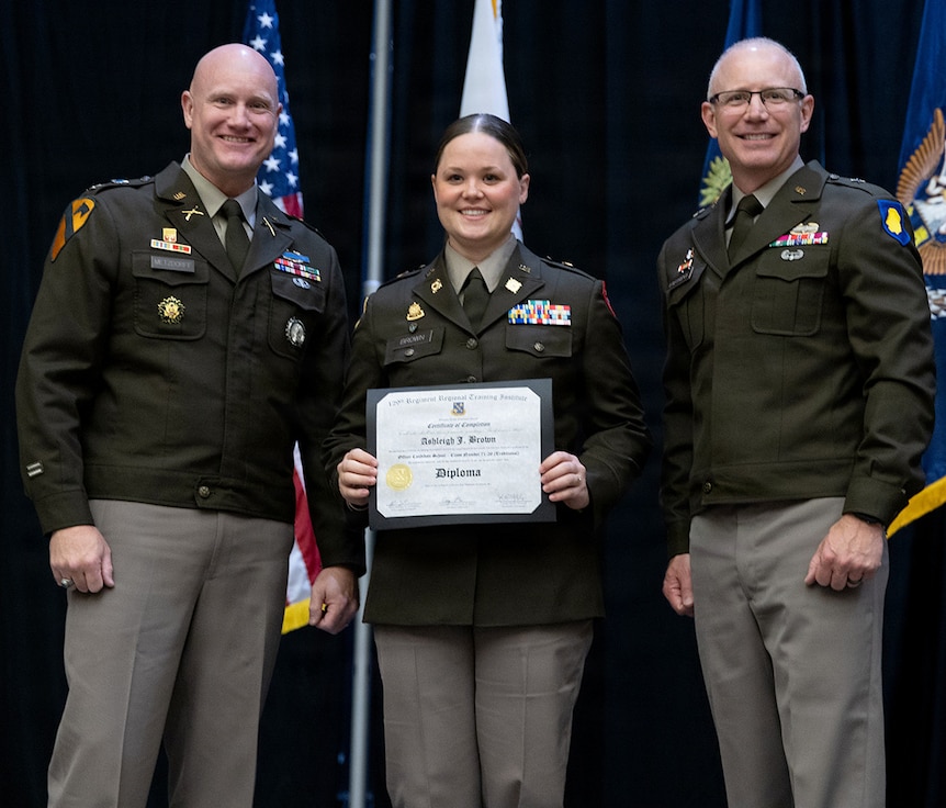Newly commissioned 2nd Lt. Ashleigh Brown is presented with certificate of completion of the Illinois Army National Guard Officer Candidate School.