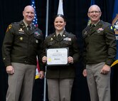 Newly commissioned 2nd Lt. Ashleigh Brown is presented with certificate of completion of the Illinois Army National Guard Officer Candidate School.
