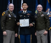Newly commissioned 2nd Lt. Tianyu Gai is presented with certificate of completion of the Illinois Army National Guard Officer Candidate School.