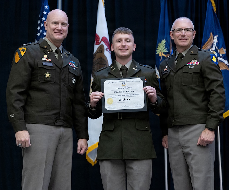 Newly commissioned 2nd Lt. Timothy Gillmore is presented with certificate of completion of the Illinois Army National Guard Officer Candidate School.