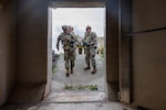 U.S. Air Force and Air National Guard medical personnel move patients to a hardened shelter during Exercise Northern Strike 26-2 at Alpena Combat Readiness Training Center, Michigan, Aug. 10, 2026. Northern Strike is an Army-sponsored, joint, multinational exercise held at Michigan’s National All-Domain Warfighting Center designed to build readiness and enhance interoperability to fight and win. Photo by 1st Lt. Elise Wahlstrom.