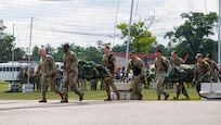 U.S. Air Force and Air National Guard medical personnel move patients to a hardened shelter during Exercise Northern Strike 26-2 at Alpena Combat Readiness Training Center, Michigan, Aug. 10, 2026.