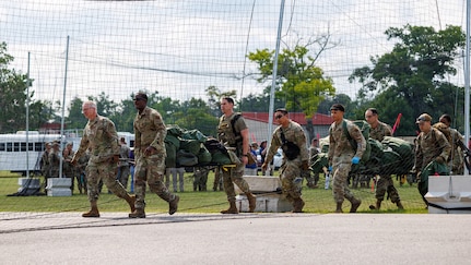 U.S. Air Force and Air National Guard medical personnel move patients to a hardened shelter during Exercise Northern Strike 26-2 at Alpena Combat Readiness Training Center, Michigan, Aug. 10, 2026.