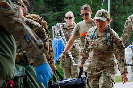 Air National Guard medical personnel move patients to a hardened shelter during Exercise Northern Strike 26-2 at Alpena Combat Readiness Training Center, Michigan, Aug. 10, 2026.