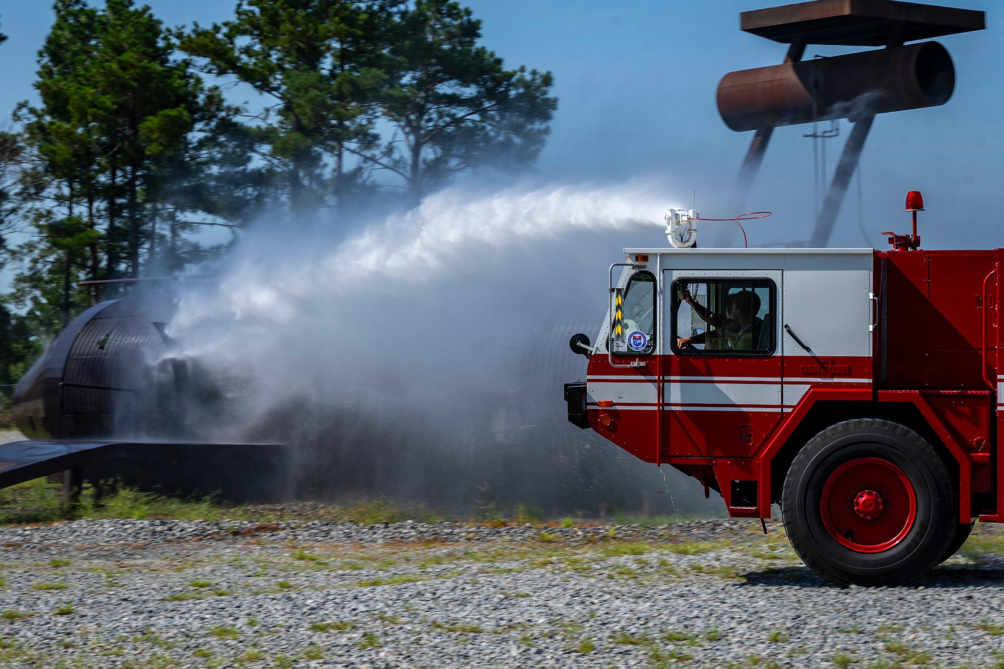 Fire truck shooting water out of the roof turret