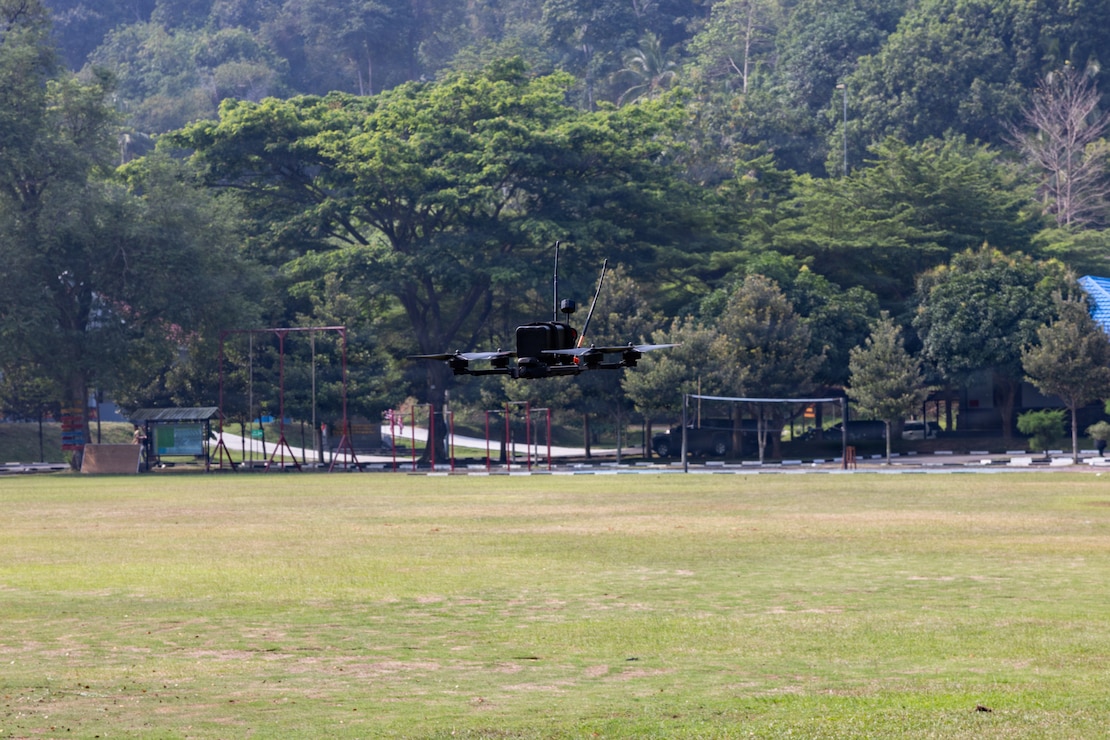 A Neros Archer first-person view drone operated by U.S. Marine Corps Lance Cpl. Josh Pinon, a radio operator with Alpha Company, 1st Battalion, 5th Marine Regiment, Marine Rotational Force – Darwin 26, flies during a demonstration as part of a platoon exchange at the Indonesian Marine Corps 7th Battalion base near Lampung, Indonesia, Aug. 24, 2026.