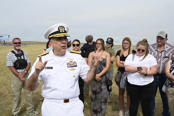BILLINGS, Mont. (Aug. 22, 2026) – U.S. Navy Rear Adm. Matthew Case, acting surgeon general and acting chief, U.S. Navy Bureau of Medicine and Surgery, speaks to family and friends of future Sailors, Marines, Soldiers, and Airmen at the Yellowstone International Air Show during Billings Navy Week, Aug. 22. Case administered the oath of enlistment to over 40 future servicemembers. Navy Medicine's 44,000+ talented and ready forces optimize health readiness, deliver quality healthcare, and provide global expeditionary medical support to warfighters. (U.S. Navy photo by Mass Communication Specialist 2nd Class Sasha Ambrose)