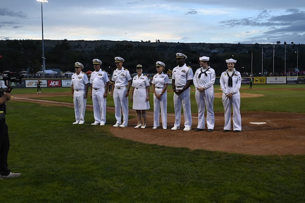BILLINGS, Mont. (Aug. 22, 2026) – U.S. Navy Rear Adm. Matthew Case, acting Surgeon General and acting chief, U.S. Navy Bureau of Medicine and Surgery, far left, joins U.S. Navy Sailors from Navy Medicine and the Nimitz-class aircraft carrier USS Harry S. Truman (CVN 75) at the Savannah Bananas baseball game during Billings Navy Week, Aug. 22. Navy Medicine's 44,000+ talented and ready forces optimize health readiness, deliver quality healthcare, and provide global expeditionary medical support to warfighters. (U.S. Navy photo by Violet Gruber)