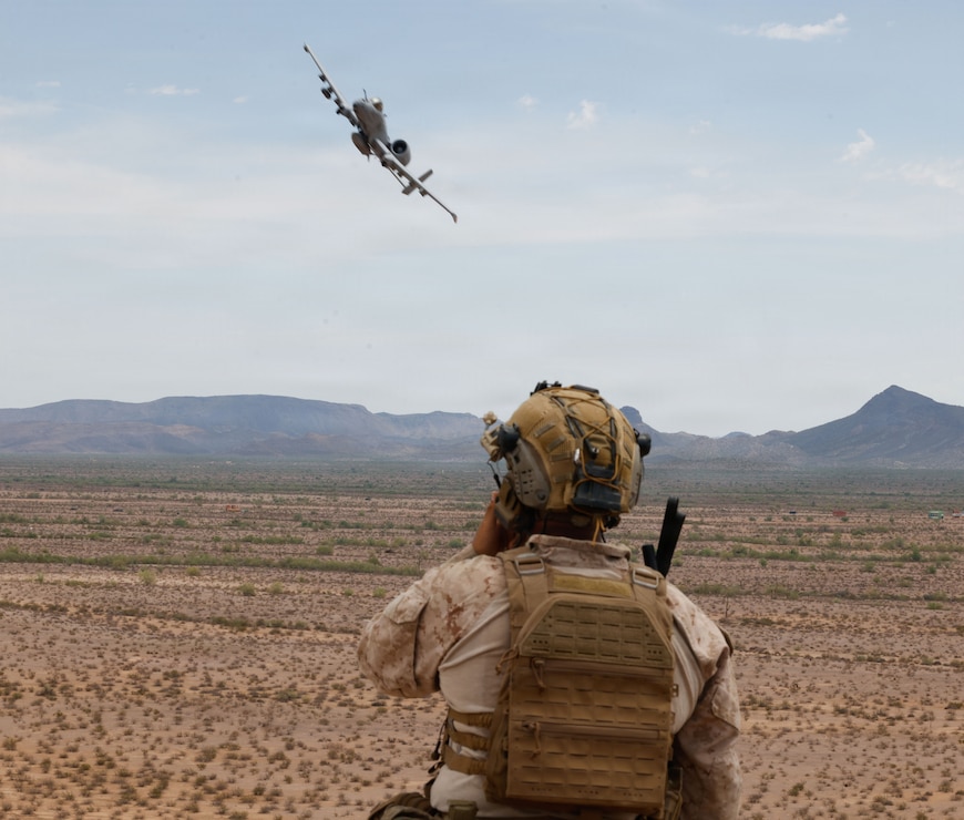 U.S. Marine Corps Cpl. Curtis Jeffress, a fire support Marine with 1st Air Naval Gunfire Liaison Company, I Marine Expeditionary Force Information Group, observes a show of force during a terminal attack control training event at Barry M. Goldwater Range, Arizona, August 11, 2026.