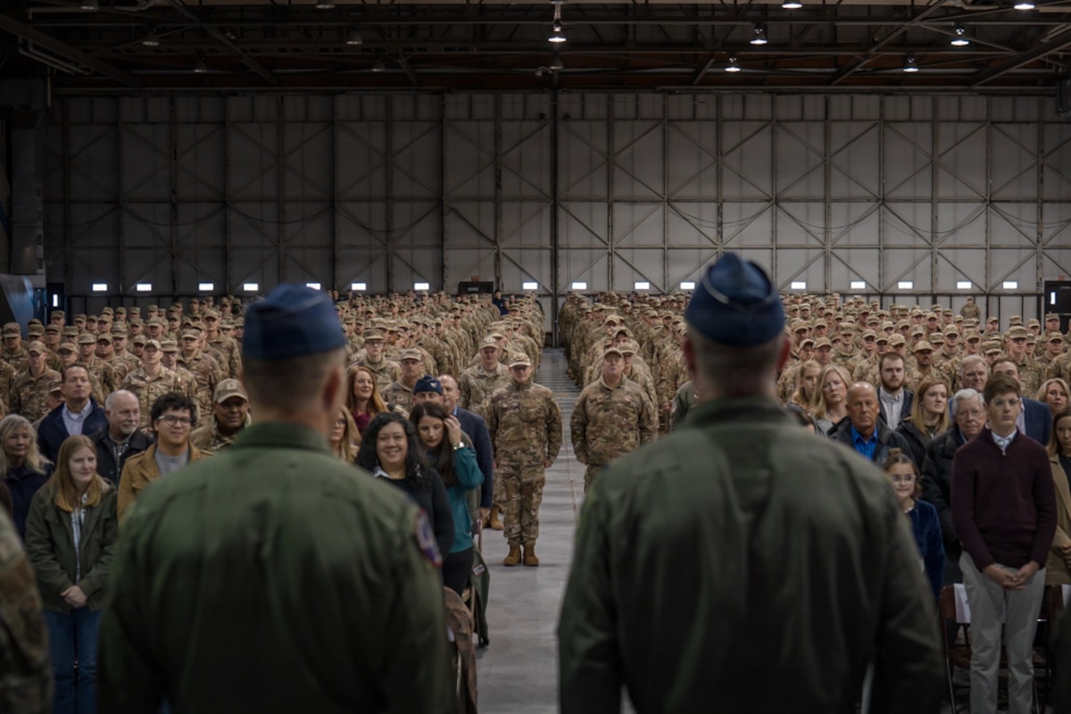 Col. Jon Friedman, incoming commander of the 114th Fighter Wing, South Dakota Air National Guard, and Col. Brandon Eskam, outgoing commander of the 114th Fighter Wing, South Dakota Air National Guard, stand before the audience during a change of command ceremony at Joe Foss Field, South Dakota, Jan. 11, 2026.