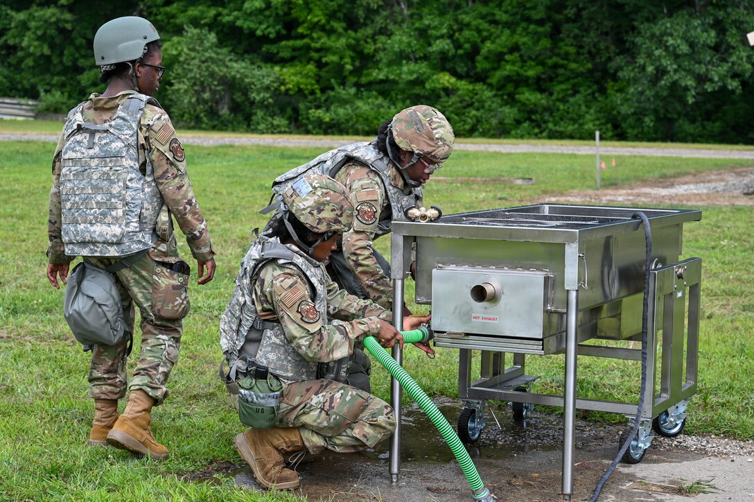 Members of the 104th Services Flight set up a field kitchen during a Combat Readiness Exercise at Westover Air Reserve Base, Chicopee, Mass., Aug. 23, 2026. Field sustainment and sanitation are primary duties performed by services personnel on deployment. A force that does not eat cannot fight. (U.S. Air National Guard photo by Airman 1st Class Elijah Harris)