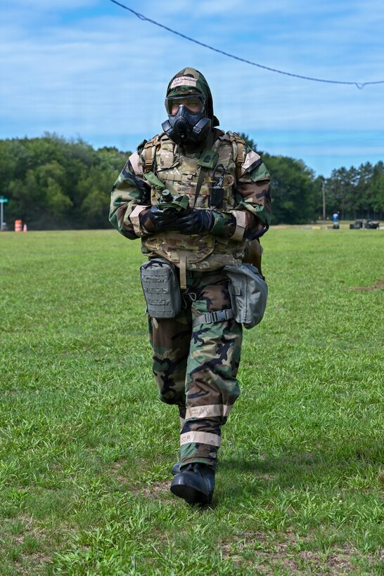 U.S. Air Force Staff Sgt. Edgar Ruiz, 104th Fighter Wing Emergency Manager, sweeps for potential chemical agents using a spectrometer during a Combat Readiness Exercise at Westover Air Reserve Base, Chicopee, Mass., Aug. 23, 2026. Handheld spectrometers, like the Raman device shown in this image, analyze the air to both detect and quantify hazardous toxic agents. When operating in an environment that may contain these threats, personnel are required to wear protective gear and respiration equipment. (U.S. Air National Guard photo by Airman 1st Class Elijah Harris)