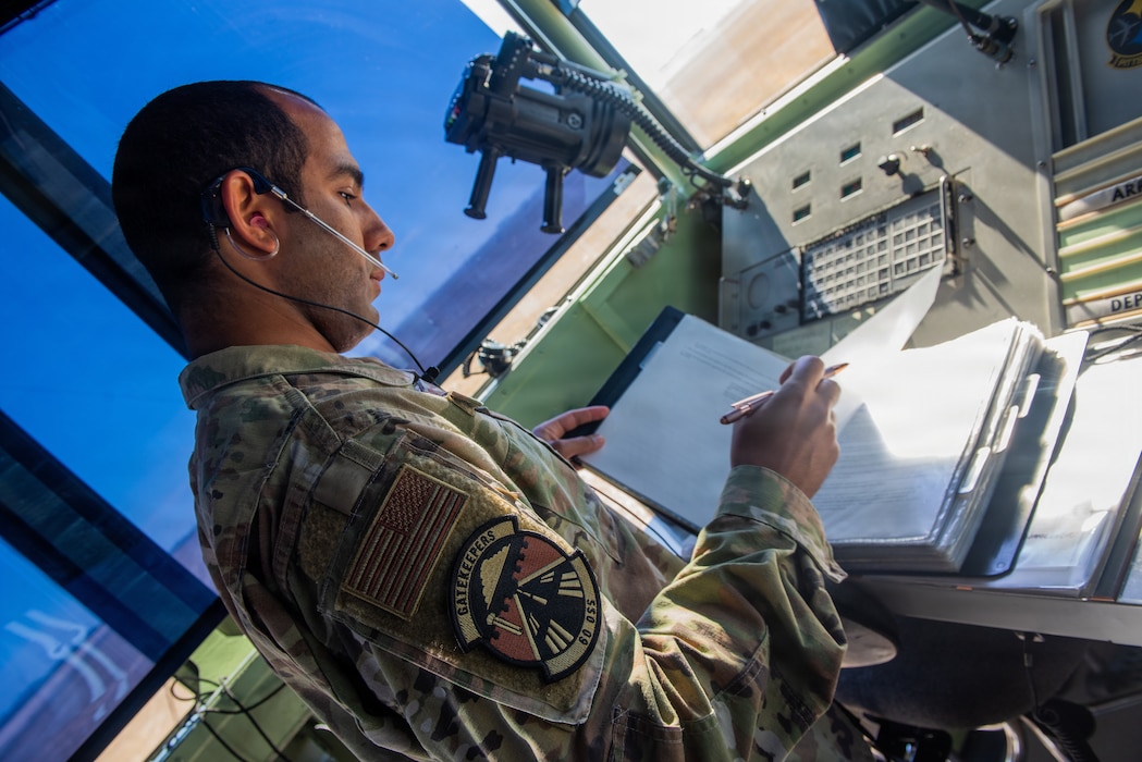 Airman reviewing flight information inside the tower