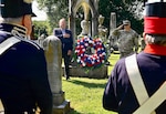 Mark Hudson, Executive Director of Historic Congressional Cemetery, and U.S. Army Brig. Gen. Leland D. Blanchard II, Commanding General (Interim) of the D.C. National Guard, lay a wreath at the grave of U.S. Army Pvt. Andrew Coyle during a Battle of Bladensburg commemoration at Historic Congressional Cemetery in Washington, D.C., Aug. 24, 2026. The Maryland Society, Sons of the American Revolution Color Guard then rendered a ceremonial volley honoring the Citizen-Soldiers who answered the call to defend the nation’s capital in 1814. (U.S. Air National Guard photo by Master Sgt. Arthur M. Wright)