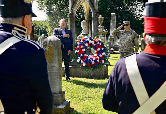 Mark Hudson, Executive Director of Historic Congressional Cemetery, and U.S. Army Brig. Gen. Leland D. Blanchard II, Commanding General (Interim) of the D.C. National Guard, lay a wreath at the grave of U.S. Army Pvt. Andrew Coyle during a Battle of Bladensburg commemoration at Historic Congressional Cemetery in Washington, D.C., Aug. 24, 2026. The Maryland Society, Sons of the American Revolution Color Guard then rendered a ceremonial volley honoring the Citizen-Soldiers who answered the call to defend the nation’s capital in 1814.