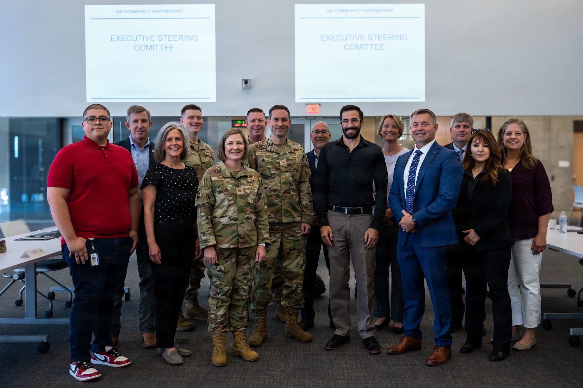 Members of the Executive Steering Committee pose for a group photo during a meeting at Tucson, Arizona, July 29, 2026. Leaders from Davis-Monthan Air Force Base and the local community met to discuss current and future initiatives for strengthening the community while building a more ready force. (U.S. Air Force photo by Senior Airman Jasmyne Bridgers-Matos)