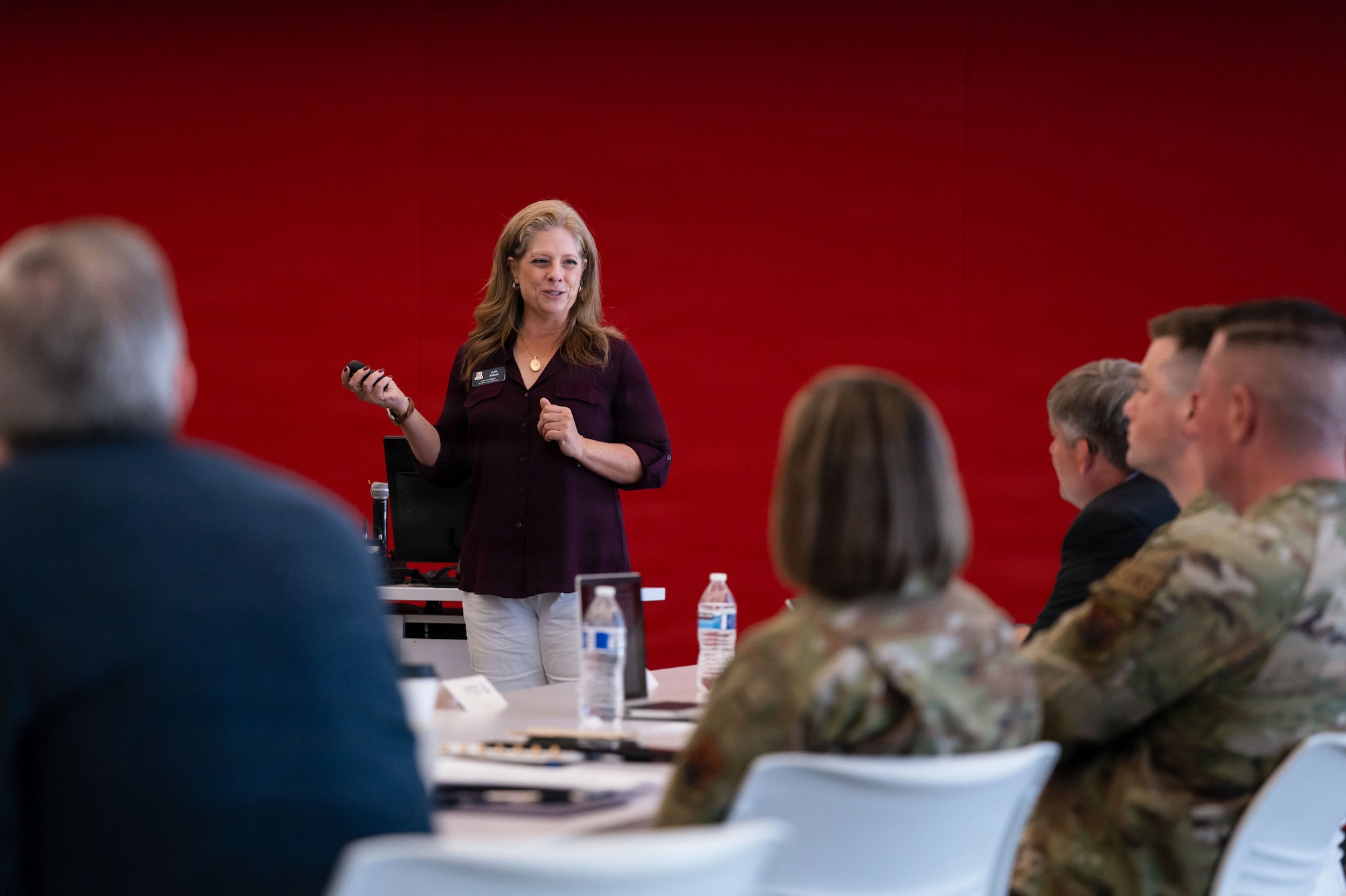 Julie Katsel, University of Arizona (UofA) executive director of community relations, updates Executive Steering Committee members on UofA activities at Tucson, Arizona, July 29, 2026. The Executive Steering Committee aligns with the Department of the Air Force Community Partnership Program by sharing resources and collaborating to build a stronger community and a more ready force. (U.S. Air Force photo by Senior Airman Jasmyne Bridgers-Matos)
