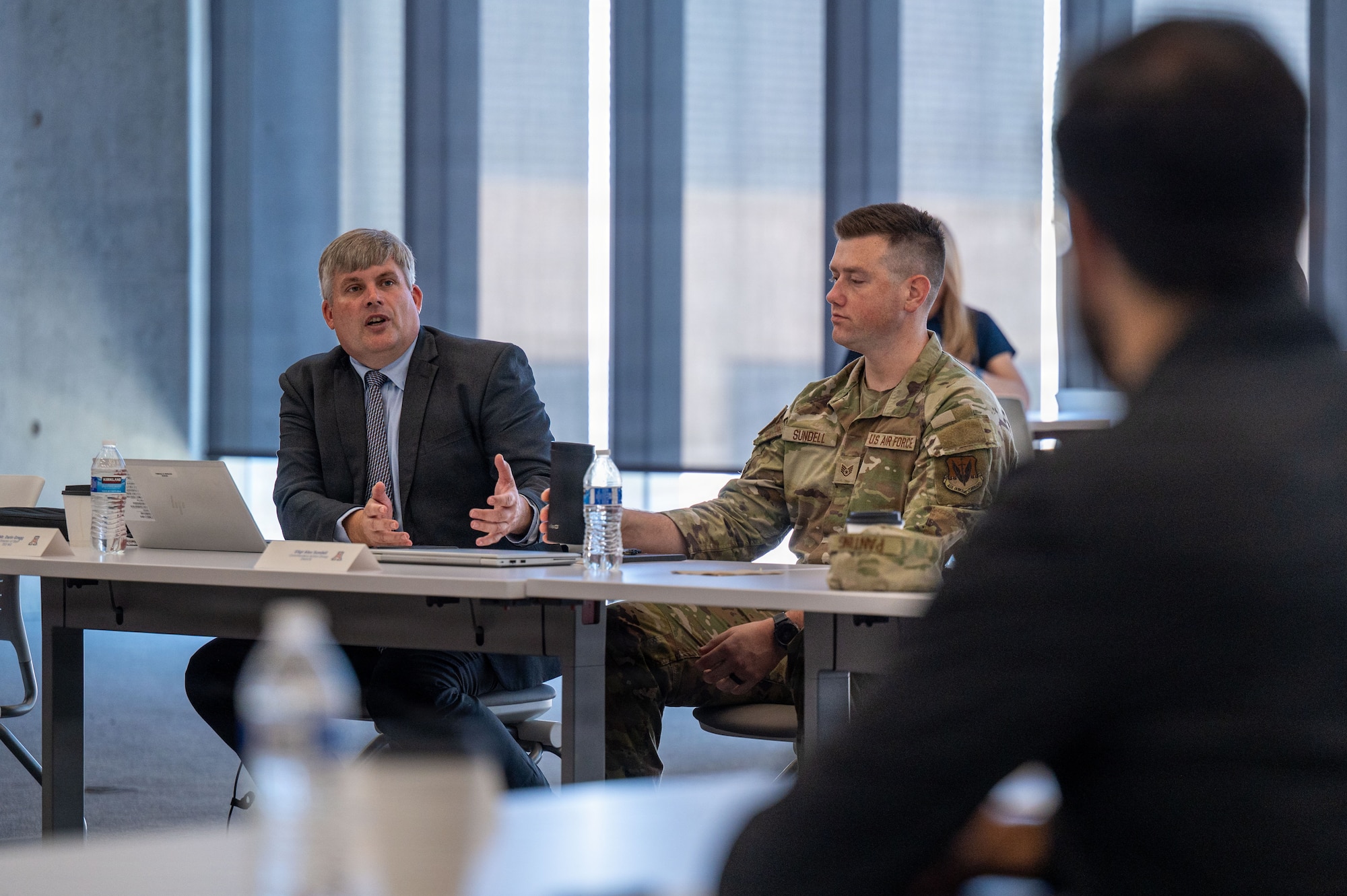 Darin Gregg, 355th Wing director of staff, discusses  current and future initiatives Davis-Monthan Air Force Base is working at Tucson, Arizona, July 29, 2026. Gregg shared DM’s goal of all participants seeing tangible results through workforce development, shared resources and community integration. (U.S. Air Force photo by Senior Airman Jasmyne Bridgers-Matos)