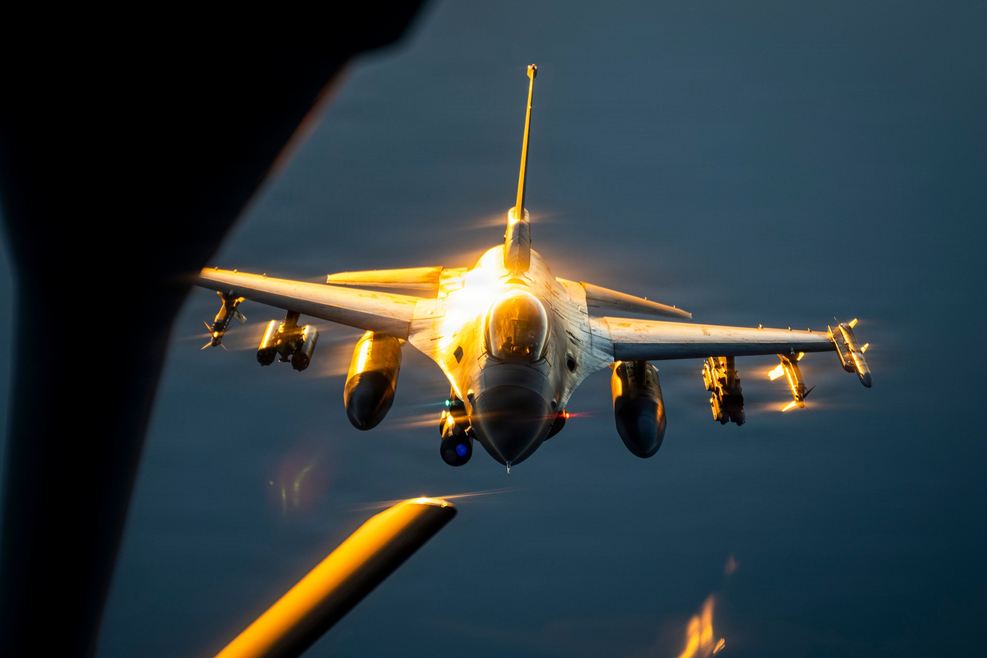 A U.S. Air Force F-16 Fighting Falcon aircraft approaches a KC-135 Stratotanker aircraft to refuel in the U.S. Central Command area of responsibility.
