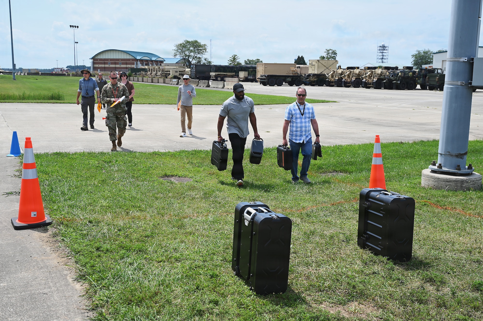 Members of the Air Force and Ohio Air National Guard look at laptops during field prototype testing evaluation for the Collaborative Combat Aircraft (CCA) Portable Command and Control Enclave (C2E).

(U.S. Air National Guard photo by Shane Hughes).