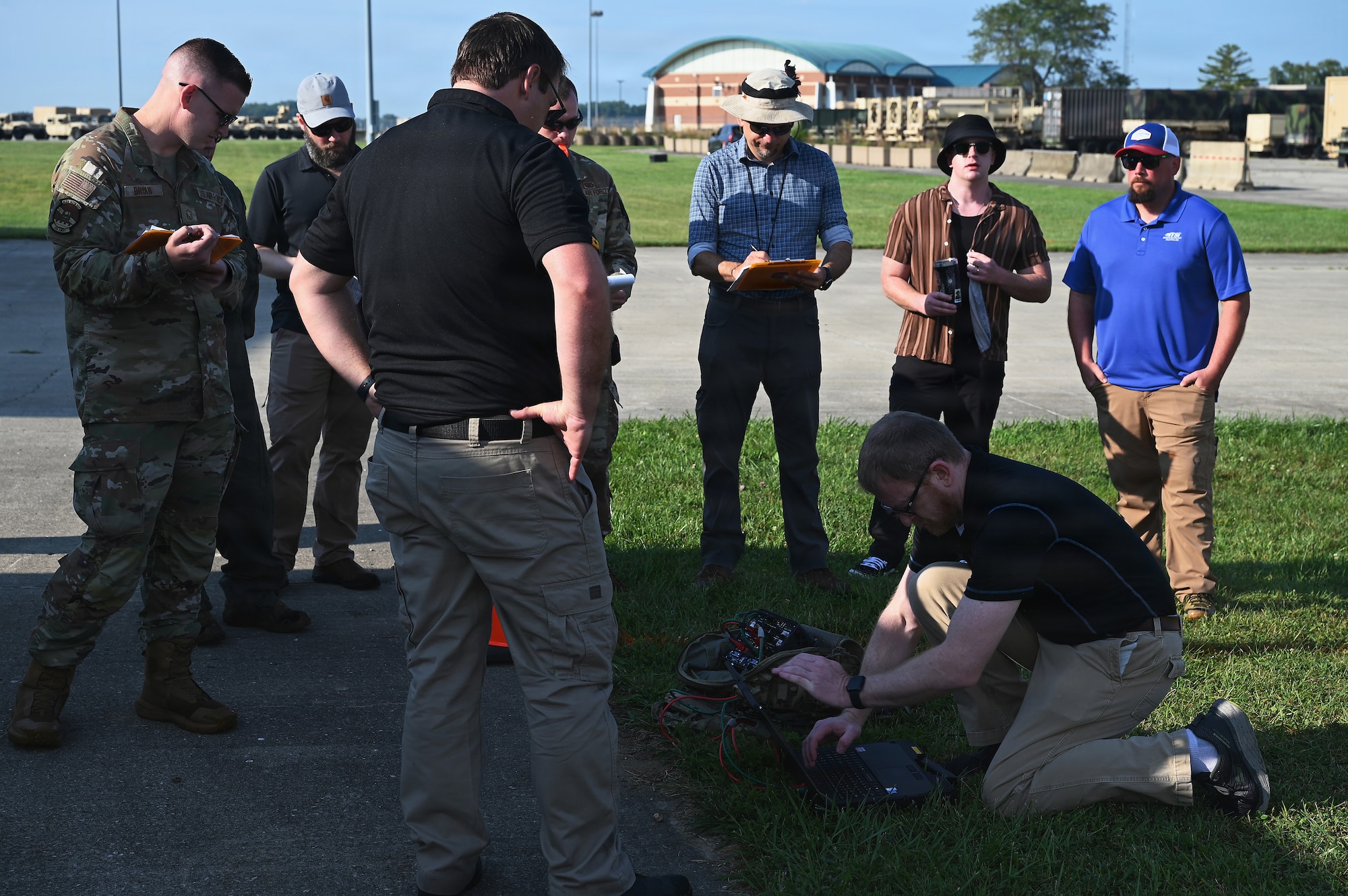 Members of the Air Force and Ohio Air National Guard look at laptops during field prototype testing evaluation for the Collaborative Combat Aircraft (CCA) Portable Command and Control Enclave (C2E).

(U.S. Air National Guard photo by Shane Hughes).