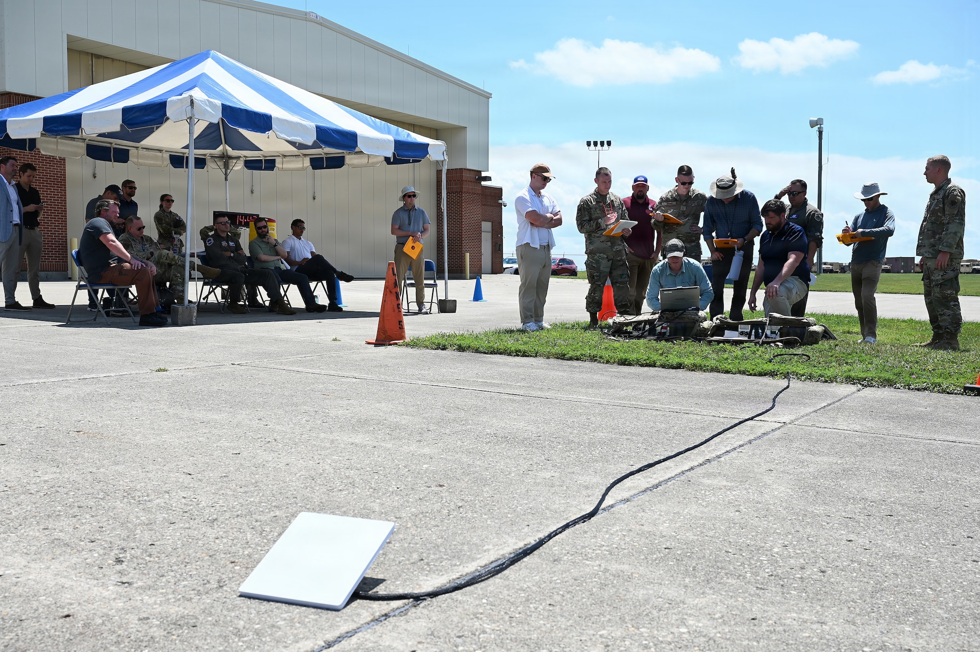 Members of the Air Force and Ohio Air National Guard look at laptops during field prototype testing evaluation for the Collaborative Combat Aircraft (CCA) Portable Command and Control Enclave (C2E).

(U.S. Air National Guard photo by Shane Hughes).