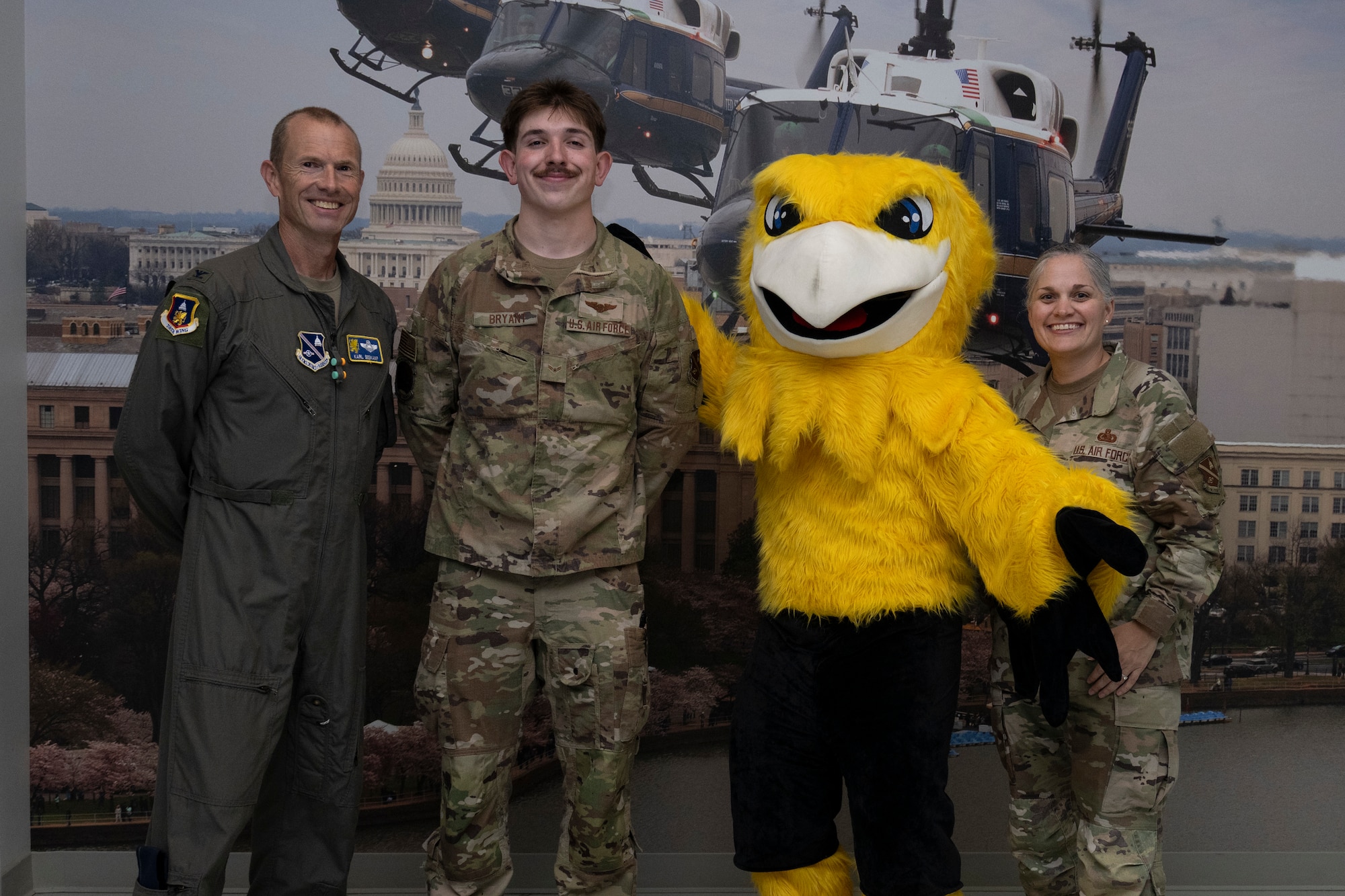 Photo of Airmen and Griffin mascot