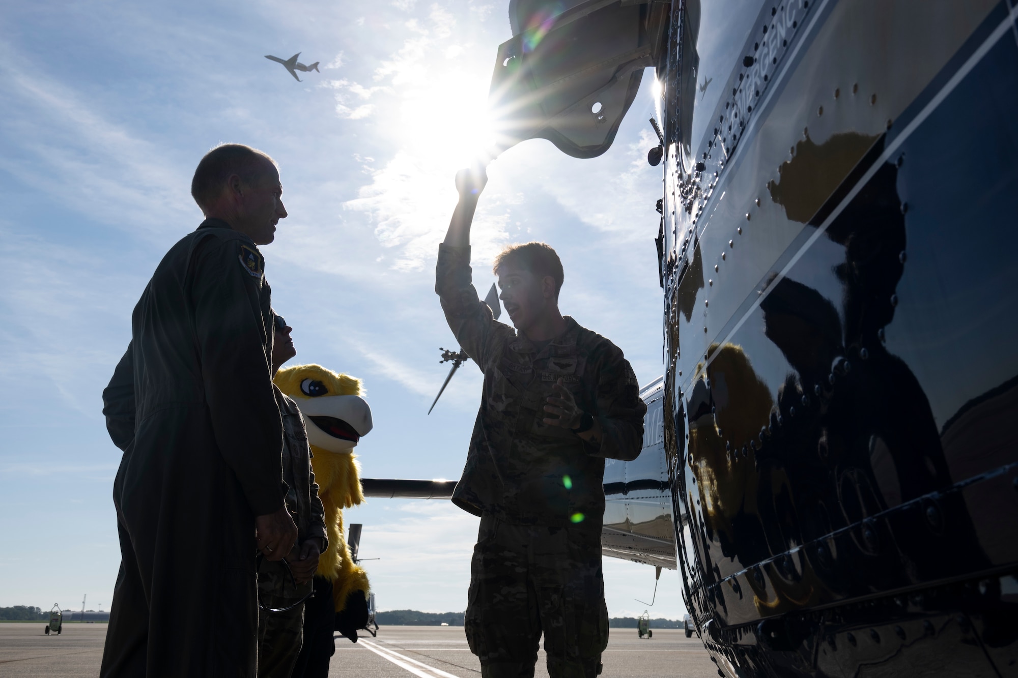 Photo of Airmen and UH-1N Huey
