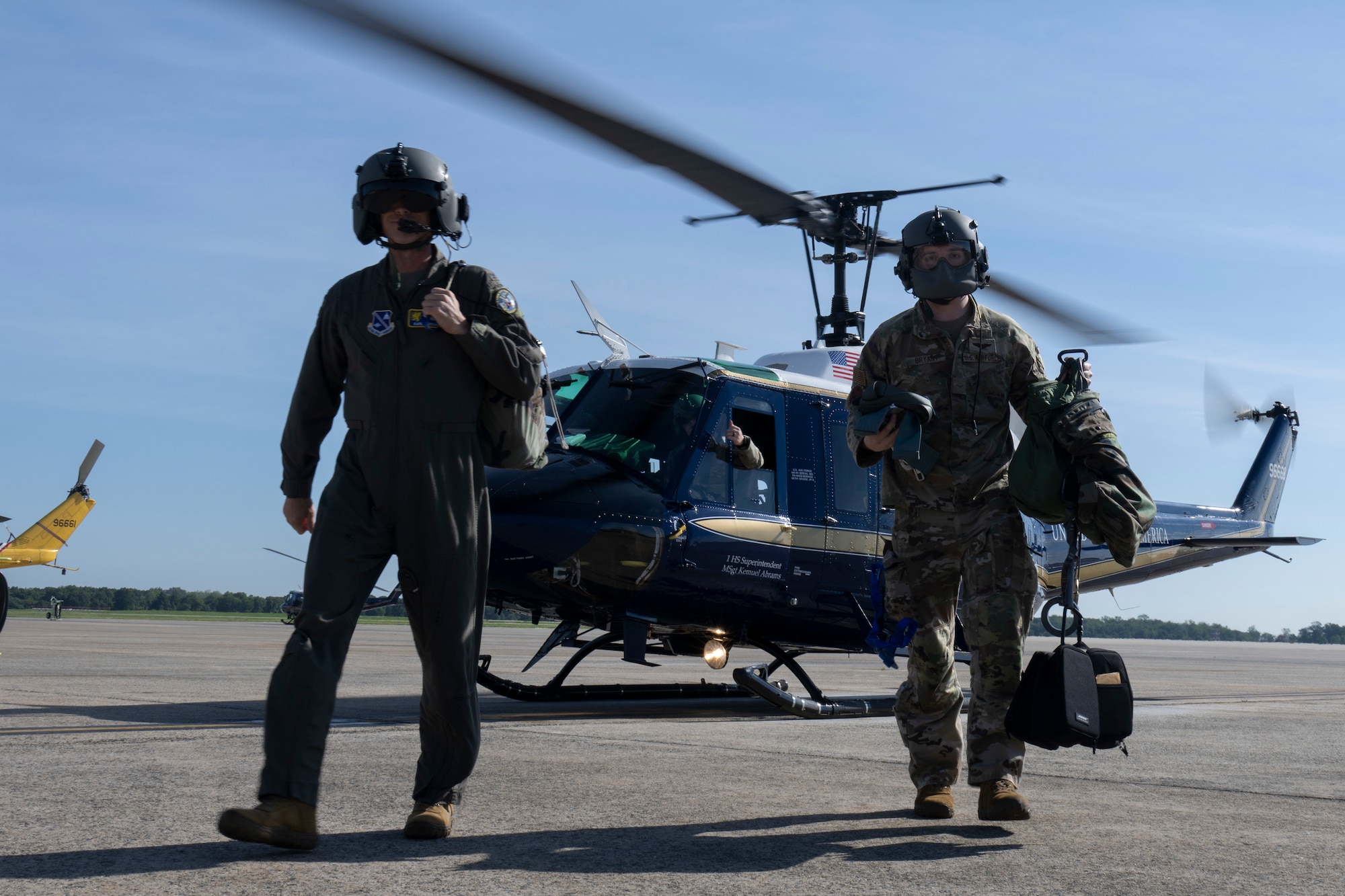 Photo of Airmen and helicopter