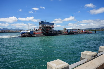 The Virginia-class fast-attack submarine USS North Carolina (SSN 777) transits the waters of Pearl Harbor to the piers following a successful undocking evolution at Pearl Harbor Naval Shipyard and Intermediate Maintenance Facility (PHNSY & IMF) in Pearl Harbor, Hawaii, Aug. 12, 2026.