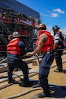 U.S. Navy Sailors assigned to the Virginia-class fast-attack submarine USS North Carolina (SSN 777) handle mooring lines as they prepare to moor the vessel along the piers in Pearl Harbor, Hawaii, Aug. 12, 2026.