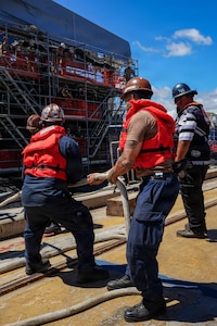 U.S. Navy Sailors assigned to the Virginia-class fast-attack submarine USS North Carolina (SSN 777) handle mooring lines as they prepare to moor the vessel along the piers in Pearl Harbor, Hawaii, Aug. 12, 2026.