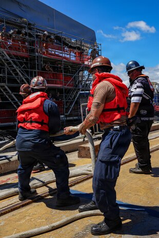 U.S. Navy Sailors assigned to the Virginia-class fast-attack submarine USS North Carolina (SSN 777) handle mooring lines as they prepare to moor the vessel along the piers in Pearl Harbor, Hawaii, Aug. 12, 2026.