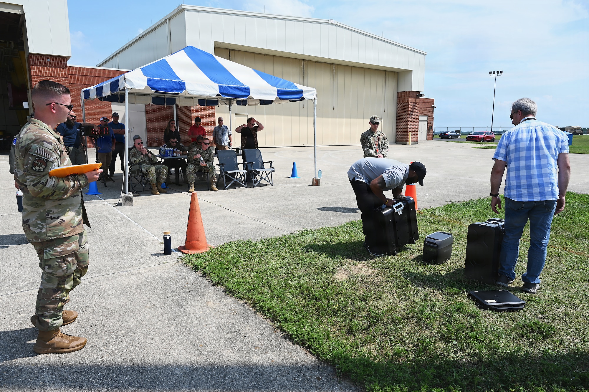 Members of the Air Force and Ohio Air National Guard look at laptops during field prototype testing evaluation for the Collaborative Combat Aircraft (CCA) Portable Command and Control Enclave (C2E).

(U.S. Air National Guard photo by Shane Hughes).