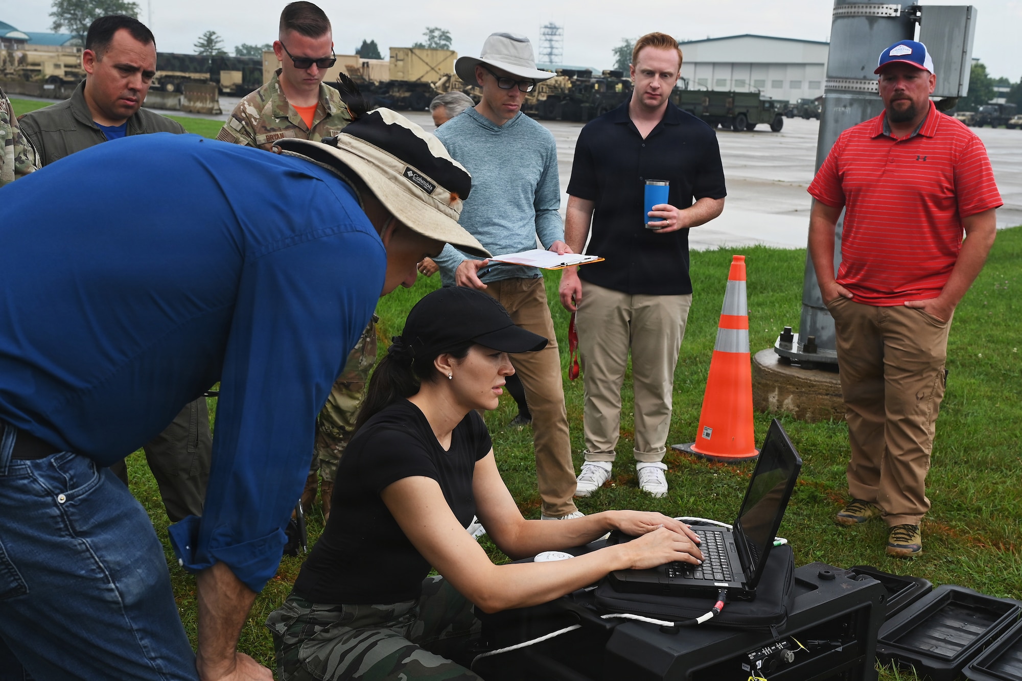 Members of the Air Force and Ohio Air National Guard look at laptops during field prototype testing evaluation for the Collaborative Combat Aircraft (CCA) Portable Command and Control Enclave (C2E).

(U.S. Air National Guard photo by Shane Hughes).