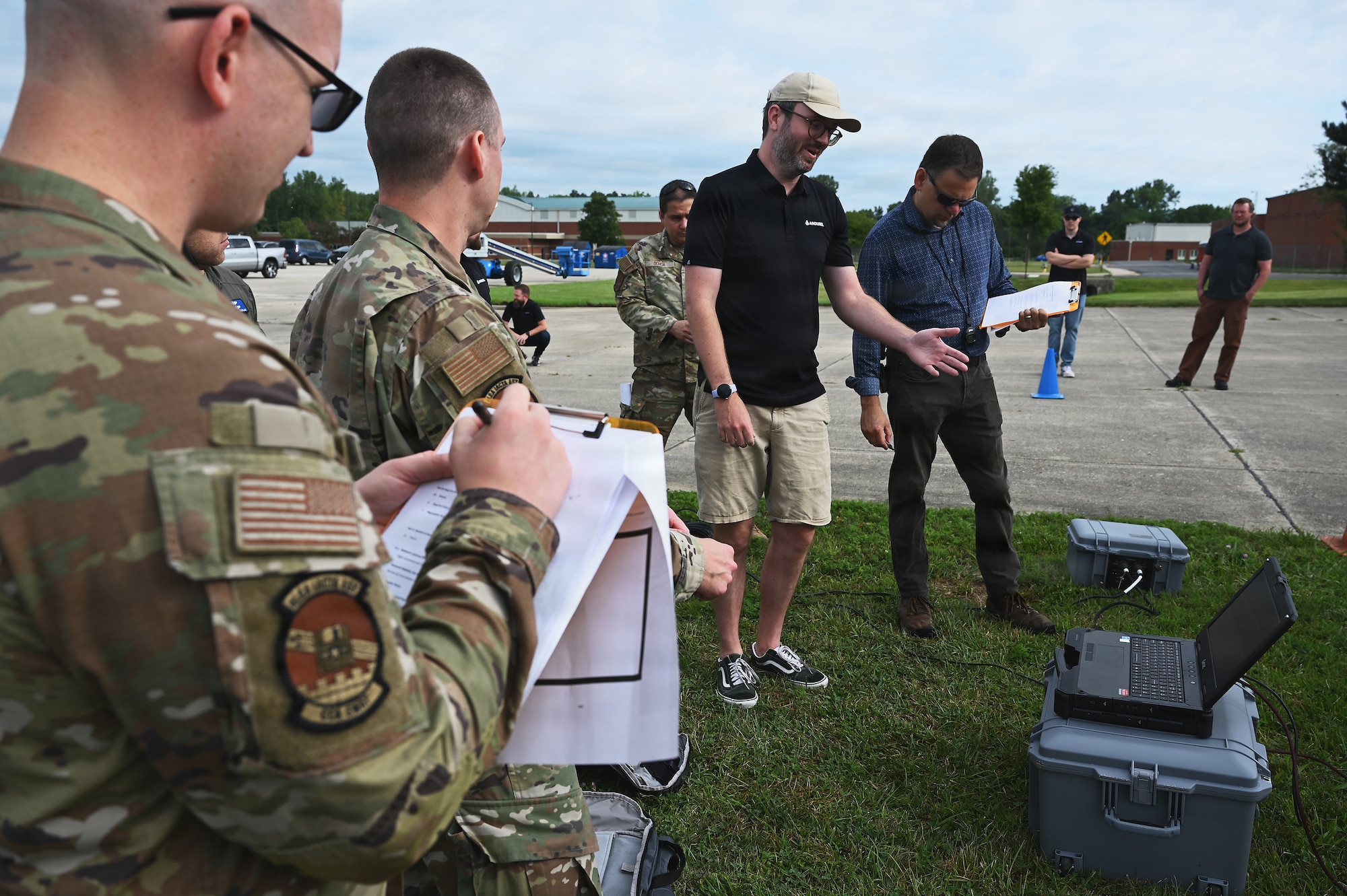 Members of the Air Force and Ohio Air National Guard look at laptops during field prototype testing evaluation for the Collaborative Combat Aircraft (CCA) Portable Command and Control Enclave (C2E).

(U.S. Air National Guard photo by Shane Hughes).