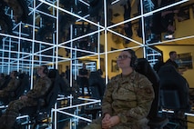U.S. Air Force Tech. Sgt. Brandie Henrichs, Airman Leadership Instructor, prepares to use the MindGym at Whiteman Air Force Base, Mo., Nov. 20, 2024. The MindGym offers a unique and immersive experience that focuses on reducing stress and promoting relaxation to help improve military readiness. (U.S. Air Force photo by Airman 1st Class Bryce Moore)