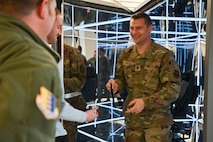 U.S. Air Force Lt. Col. Carsten Stahr, 28th Force Support Squadron commander, steps out of the MindGym after a short demonstration at Ellsworth Air Force Base, South Dakota, Feb. 2, 2024. Lumena hosted a Demo Day for Ellsworth leadership to allow them to experience the MindGym and recommend it to others. (U.S. Air Force photo by Airman 1st Class Brittany Kenney)