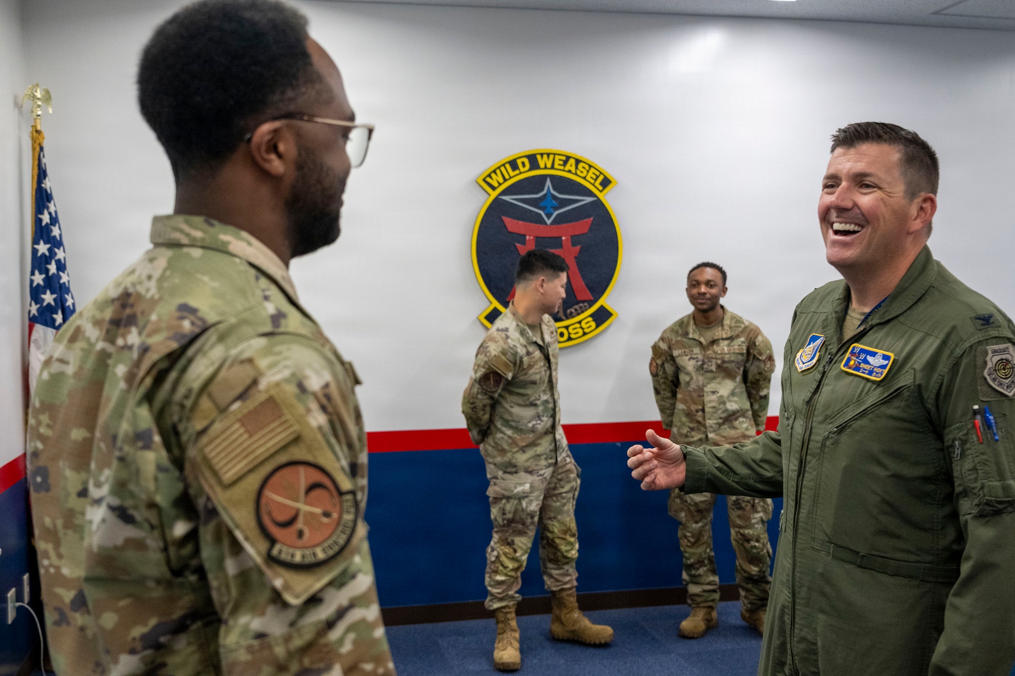 U.S. Air Force Col. Matthew T. Hoyt, 35th Fighter Wing deputy commander, speaks with Senior Airman Xavier Tanner, 610th Air Control Flight weapons director, during a Wild Weasel Walk-Through at Misawa Air Base, Japan, Aug. 24, 2026.