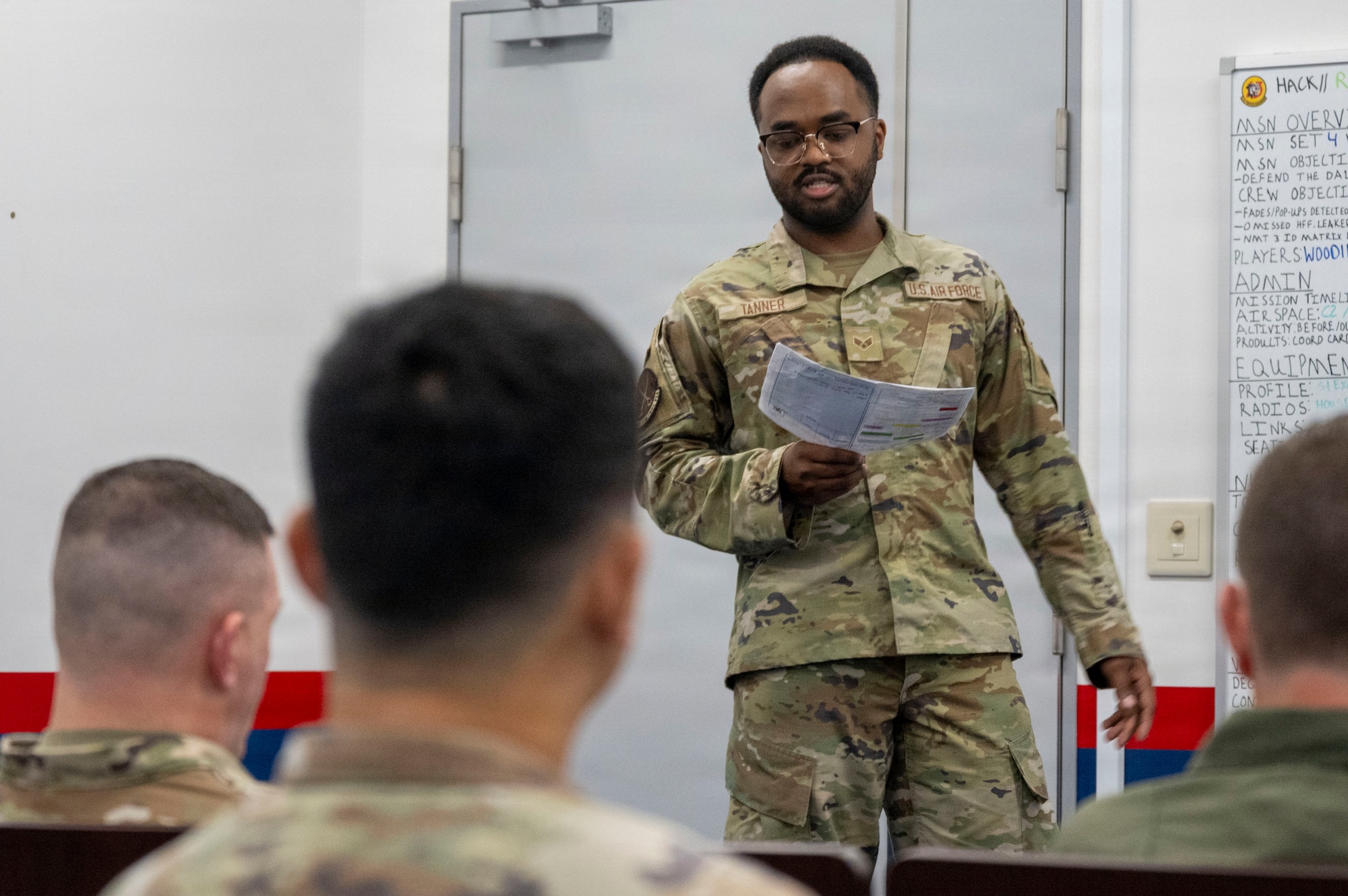 U.S. Air Force Senior Airman Xavier Tanner, 610th Air Control Flight weapons director, briefs 35th Fighter Wing leadership on weapons control operations and management of a tactical air picture during a Wild Weasel Walk-Through at Misawa Air Base, Japan, Aug. 24, 2026.