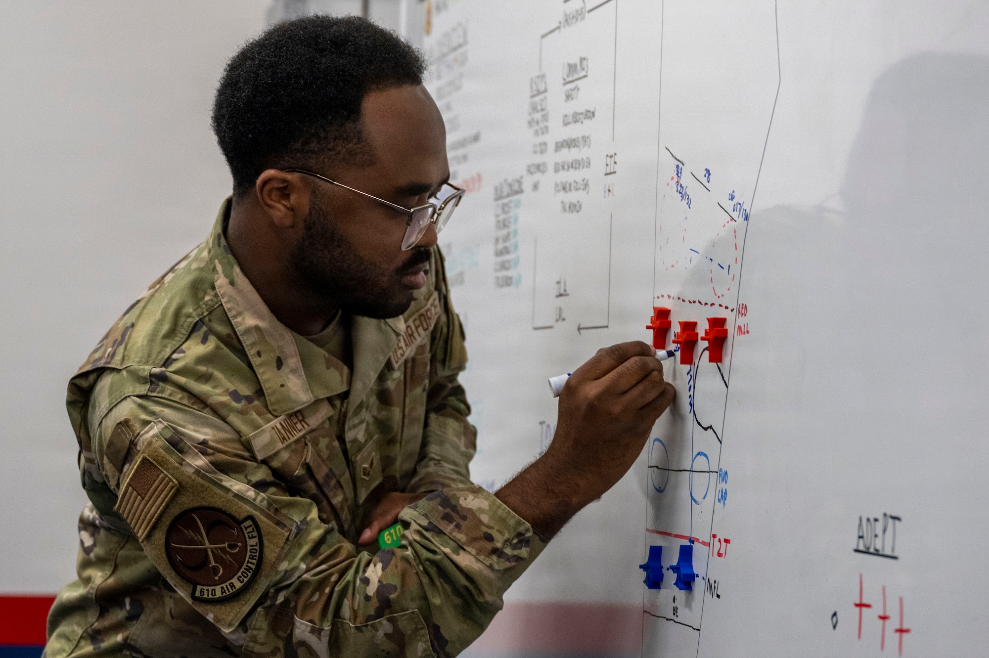 U.S. Air Force Senior Airman Xavier Tanner, 610th Air Control Flight weapons director, demonstrates management of the tactical air picture during a Wild Weasel Walk-Through at Misawa Air Base, Japan, Aug. 24, 2026.