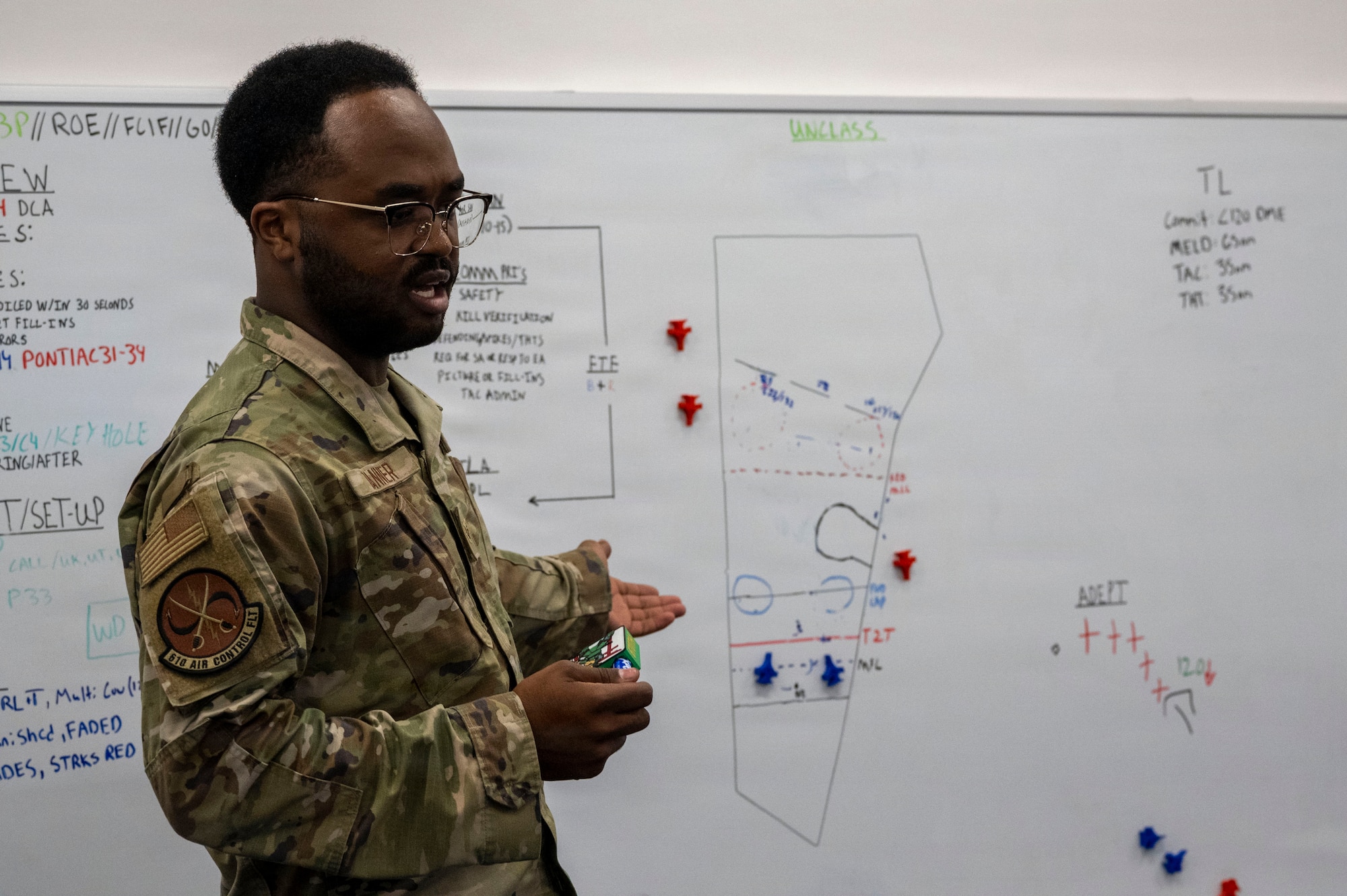 U.S. Air Force Senior Airman Xavier Tanner, 610th Air Control Flight weapons controller, explains a tactical air-control scenario during a Wild Weasel Walk-Through at Misawa Air Base, Japan, Aug. 24, 2026.