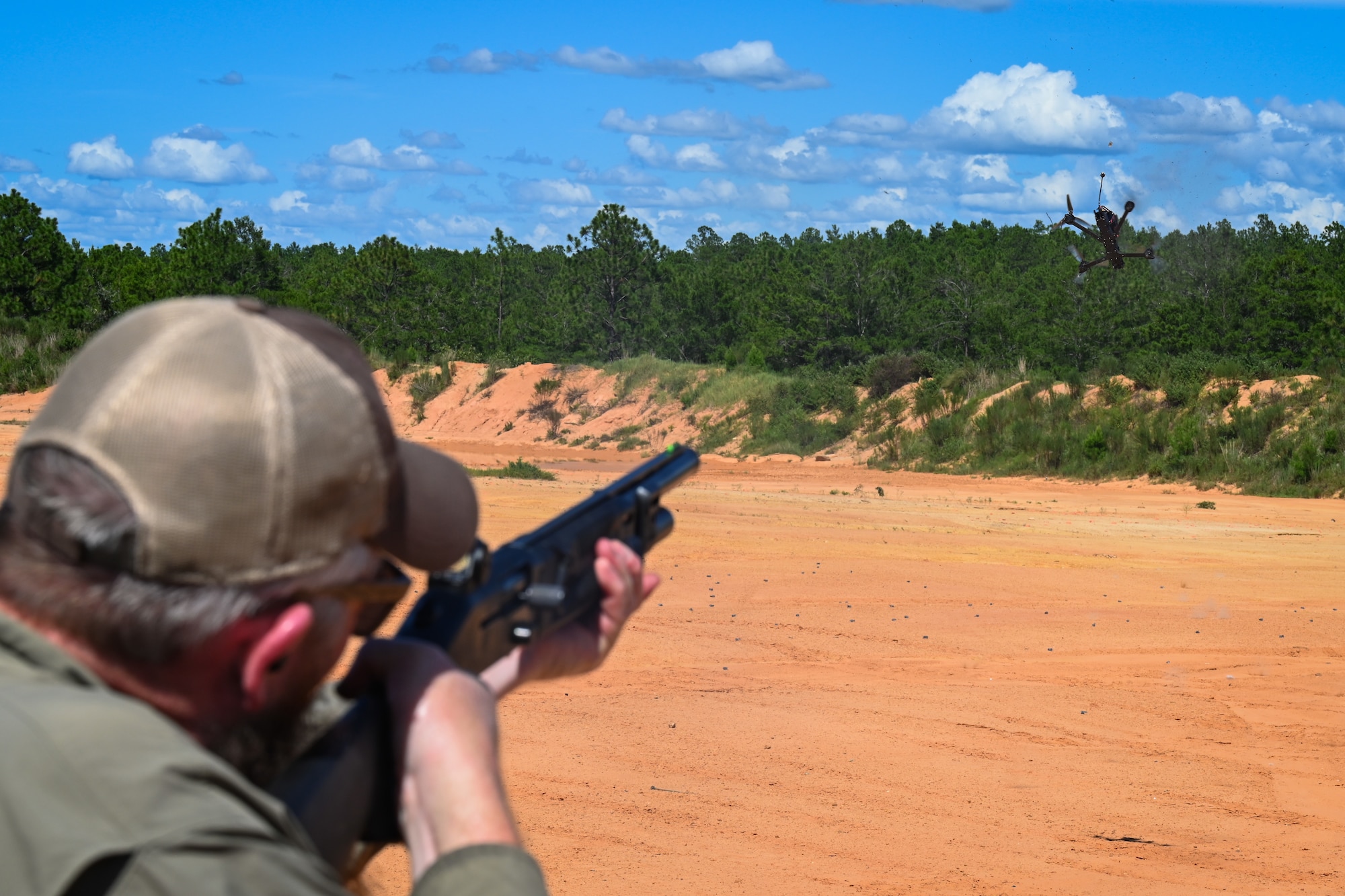 A cadre member shoots a drone during counter-small unmanned aerial system defense training near Hurlburt Field, Florida, Aug. 7, 2026. Refining base defense capabilities ensures the 31st Air Task Force can provide layered protection for deployed units. (U.S. Air Force photo by Staff Sgt. Ty Pilgrim)