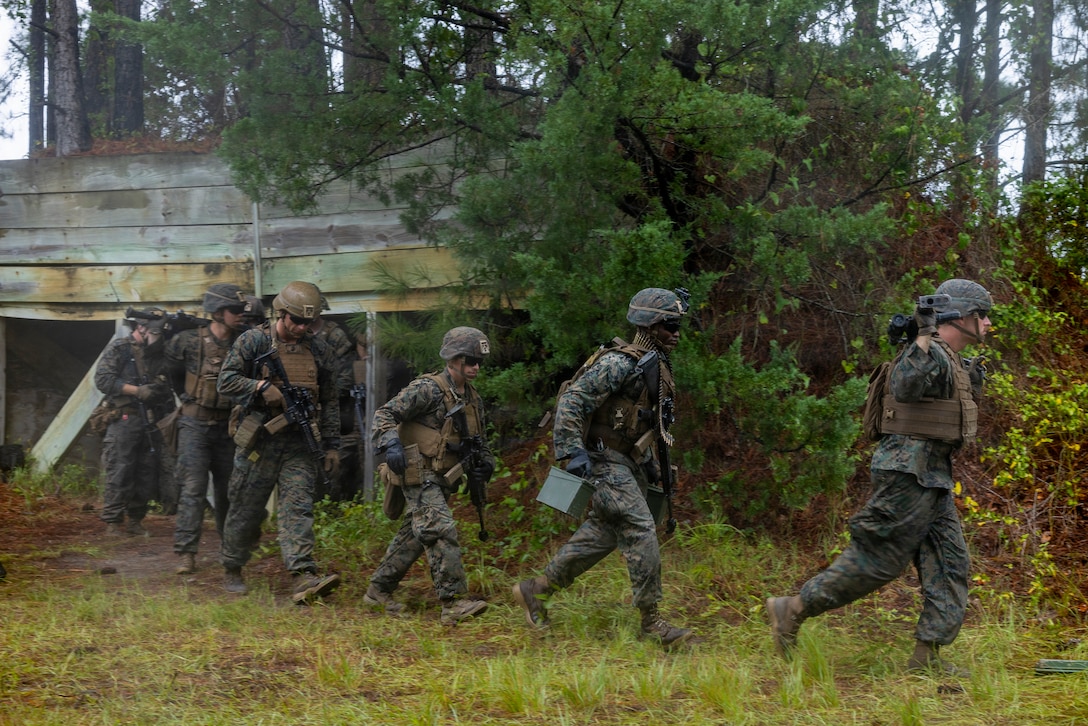 U.S. Marines with 8th Engineer Support Battalion, Combat Logistics Regiment 27, 2nd Marine Logistics Group, execute a breaching drill during a Marine Corps combat readiness evaluation at Marine Corps Base Camp Lejeune, North Carolina, August 22, 2026. The MCCRE is a formal evaluation system conducted by 8th ESB to assess the battalion’s combat readiness and ensure standardization in training and operational capabilities. (U.S. Marine Corps photo by Lance Cpl. Isabella Ramos)