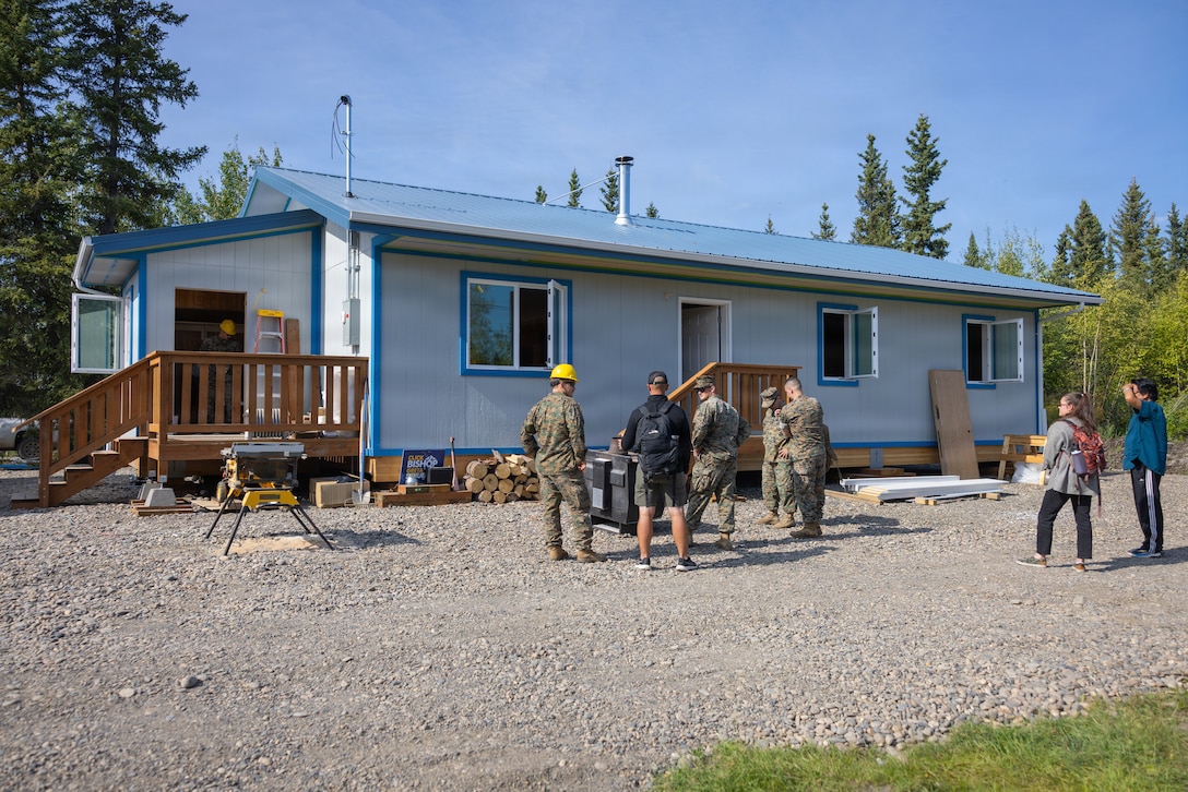 A construction site stands within the Alaskan wilderness, Beaver, Alaska, Aug. 13, 2026. Operation Arctic Shelter is an Innovative Readiness Training mission partnered with the Interior Regional Housing Authority to build affordable housing, providing Marines with critical vertical and horizontal construction training in a cold-weather environment. (U.S. Marine Corps photo by Lance Cpl. Claire Cheney)