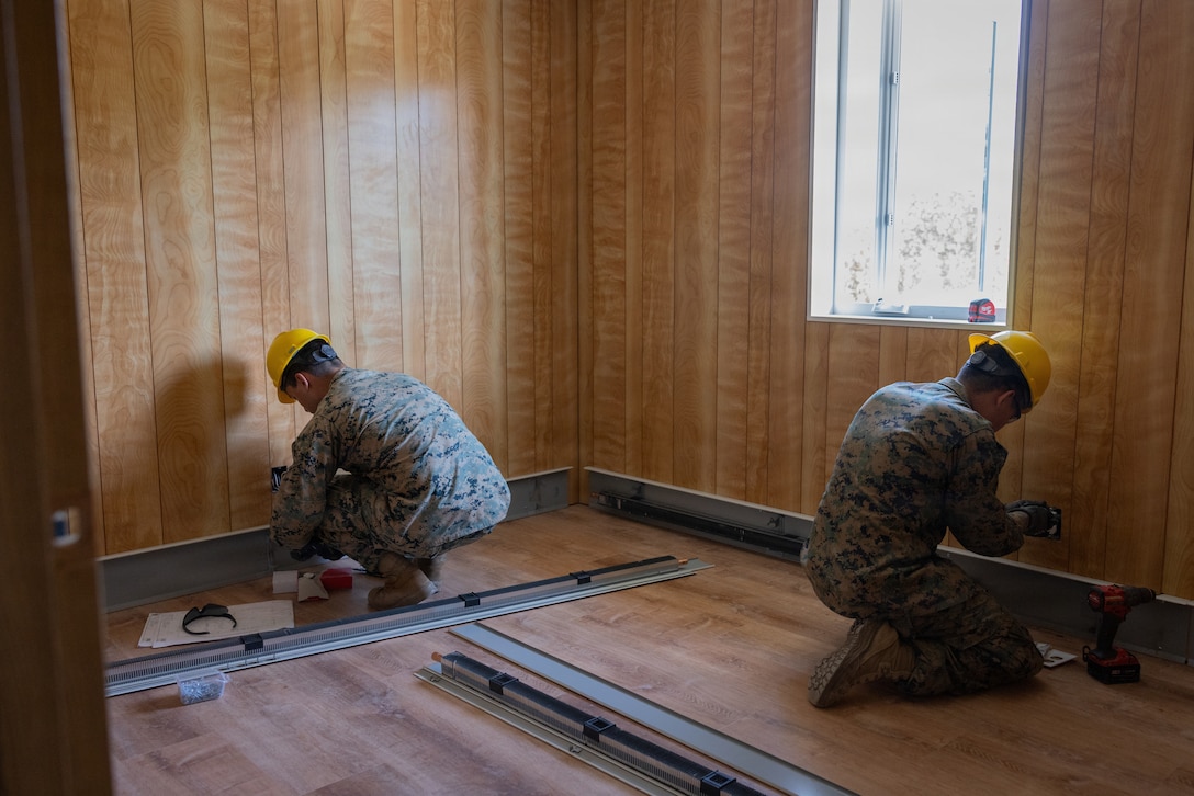 U.S. Marines with 6th Engineer Support Battalion, Force Headquarters Group, Marine Forces Reserve, fix outlets during Operation Arctic Shelter, Beaver, Alaska, Aug. 13, 2026. Operation Arctic Shelter is an Innovative Readiness Training mission partnered with the Interior Regional Housing Authority to build affordable housing, providing Marines with critical vertical and horizontal construction training in a cold-weather environment. (U.S. Marine Corps photo by Lance Cpl. Claire Cheney)