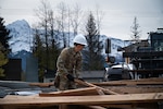 U.S. Air National Guard Senior Airman Jose Leon Castellanos, a structures specialist assigned to the 103d Civil Engineering Squadron, removes demolished lumber during a structural demolition project as part of a National Guard Bureau deployment for training, or DFT, project in Seward, Alaska, June 2, 2026. Throughout the DFT, more than 30 Airmen deconstructed a structure that was incapable of handling heavy snow loads and prepared the site for eventual rebuild by a later rotation. Photo by Capt. Jen Kaprielian.