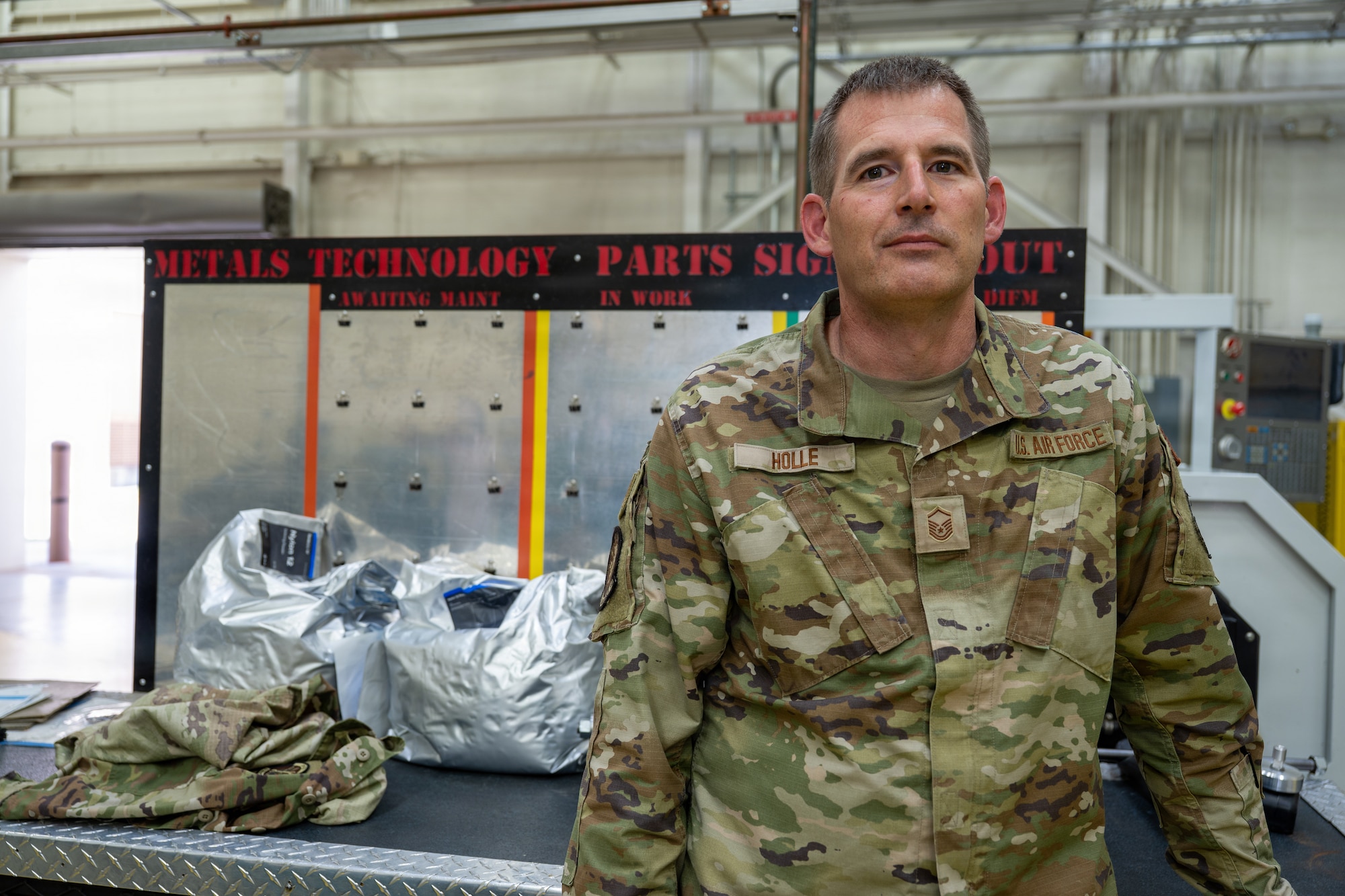 Master Sgt. Jonathon Holle, 931st Maintenance Squadron aircraft metals technician, stands in front of his work area at the Metals Technology workshop at McConnell Air Force Base, Kansas, Aug. 24, 2026. Holle developed the concept for a wheel paint and mix stand to dramatically reduce the time needed to refinish aircraft wheels, ultimately developed by the 22nd Air Refueling WIng’s Innovation Lab and created using 3-D printing capabilities. (U.S. Air Force photo by Airman Daniel Obi)